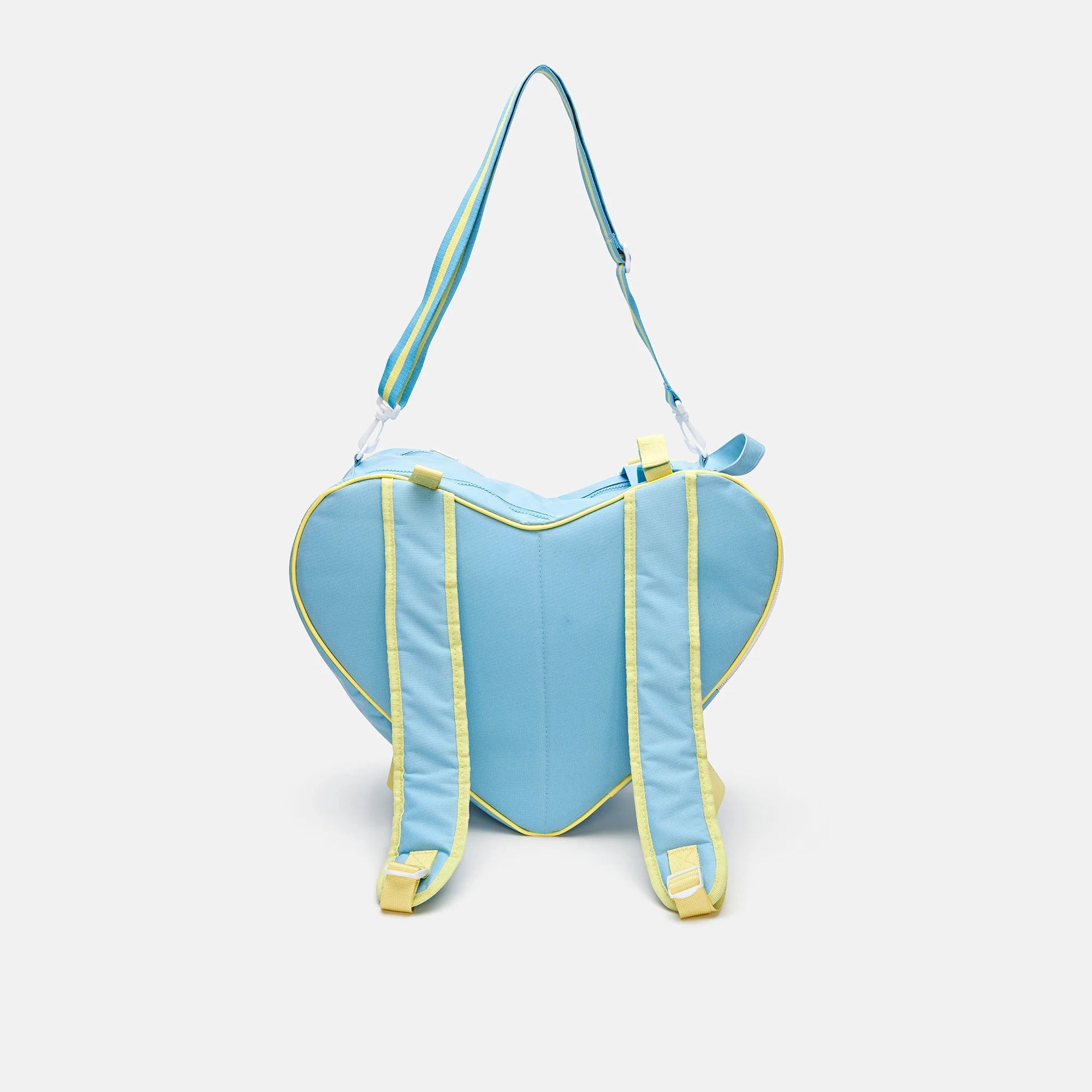 Sky blue heart-shaped skate bag with yellow back straps and top carry handle.