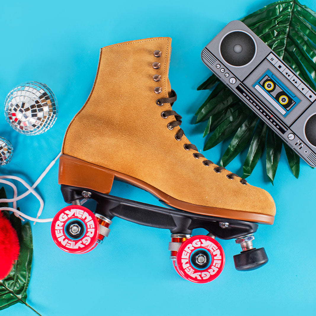 Tan suede roller skate boot with padded heel and red wheel set