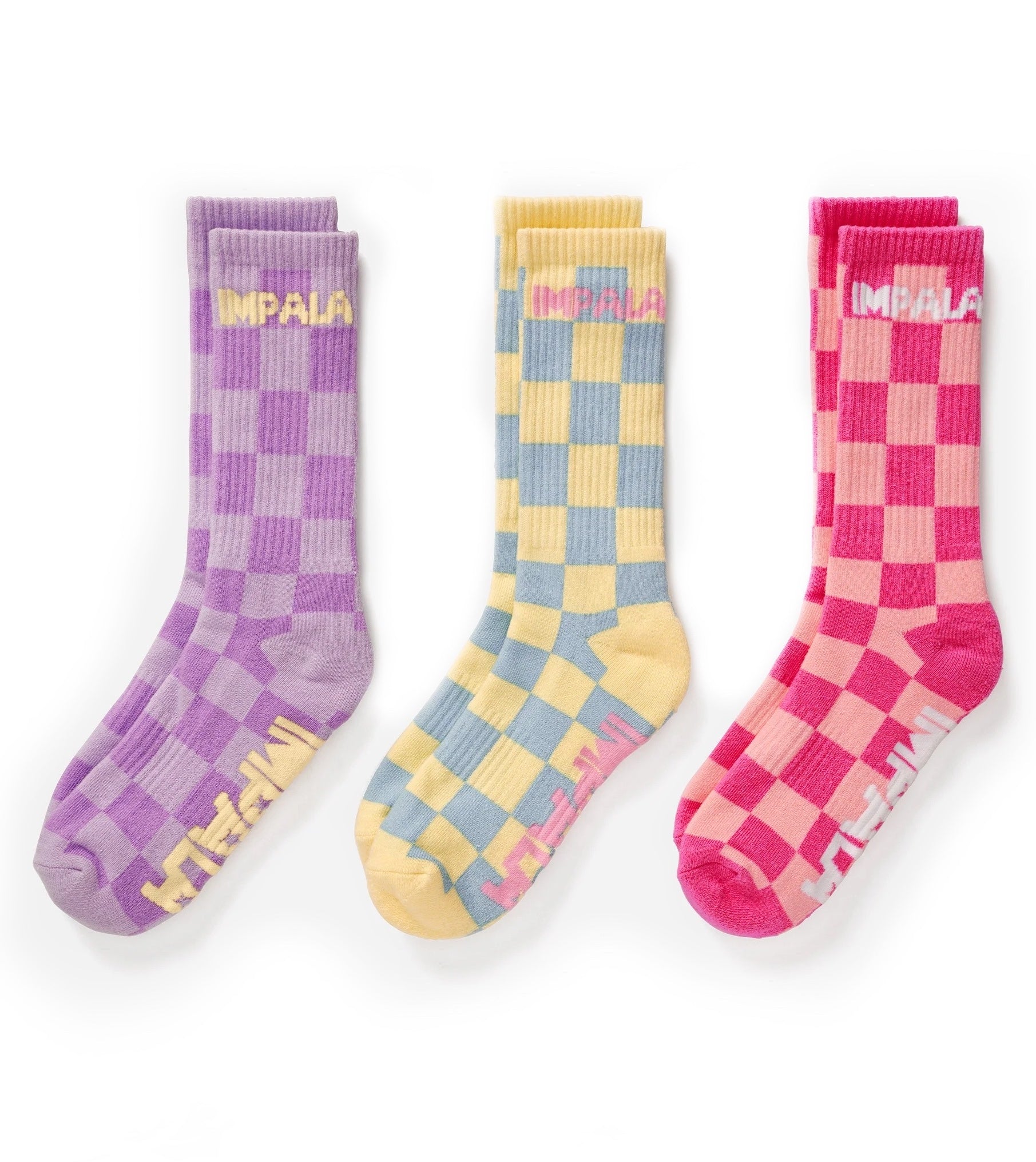 Three pairs check skate socks: purple, blue/yellow, and pink crew socks