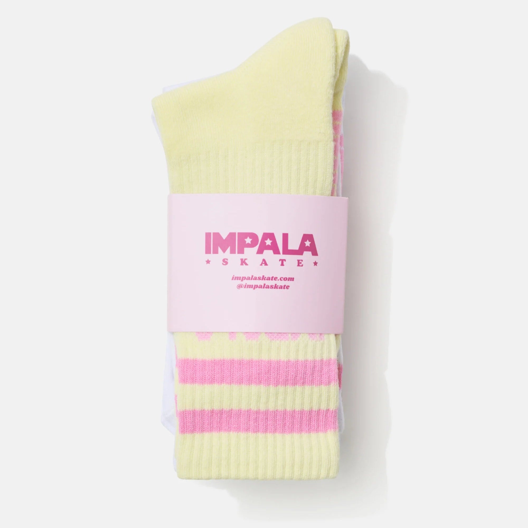 Folded crew sock in light yellow with pink stripes and Impala logo