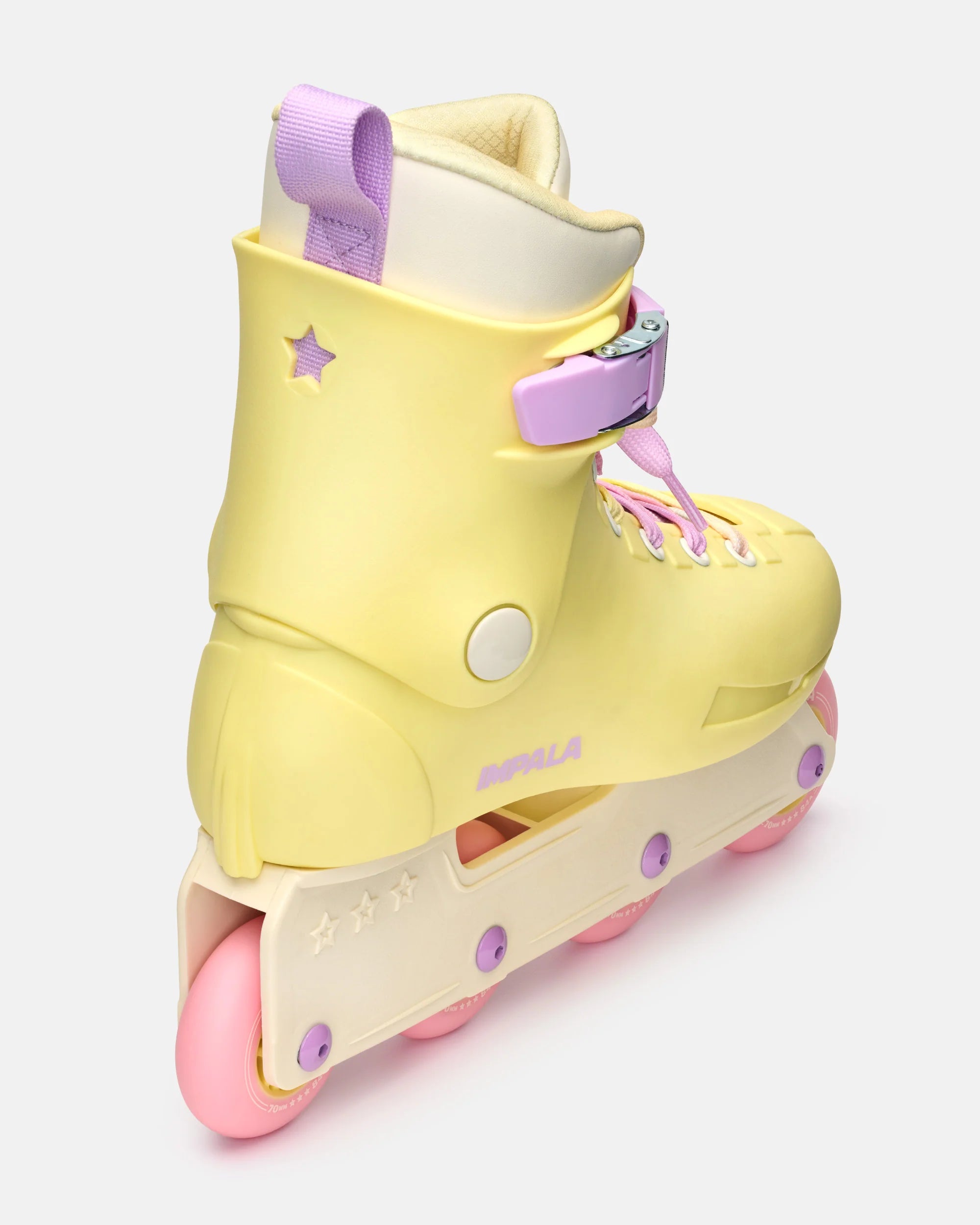 Impala buttercup yellow inline skate with star detail, pink wheels, and purple strap