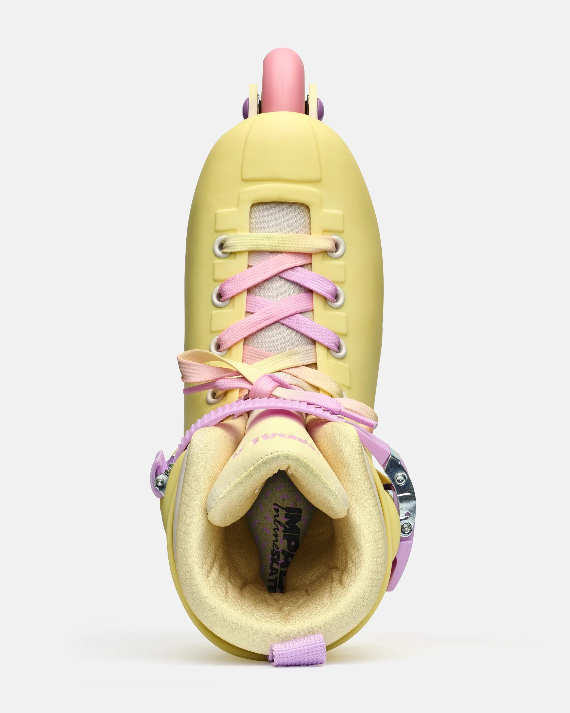 Impala buttercup yellow inline skate boot with pink laces, purple strap, and open liner