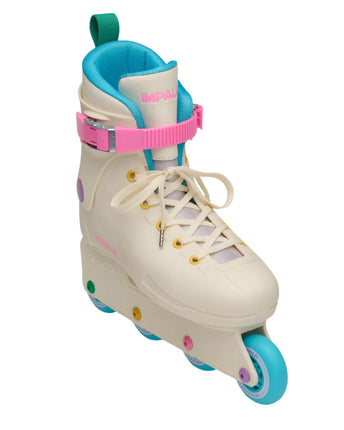 Cream inline skate with pink cuff strap, green collar, and multicolor wheels