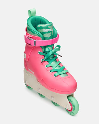 Side view of pink and green inline skates with padded collar and multi-wheel base