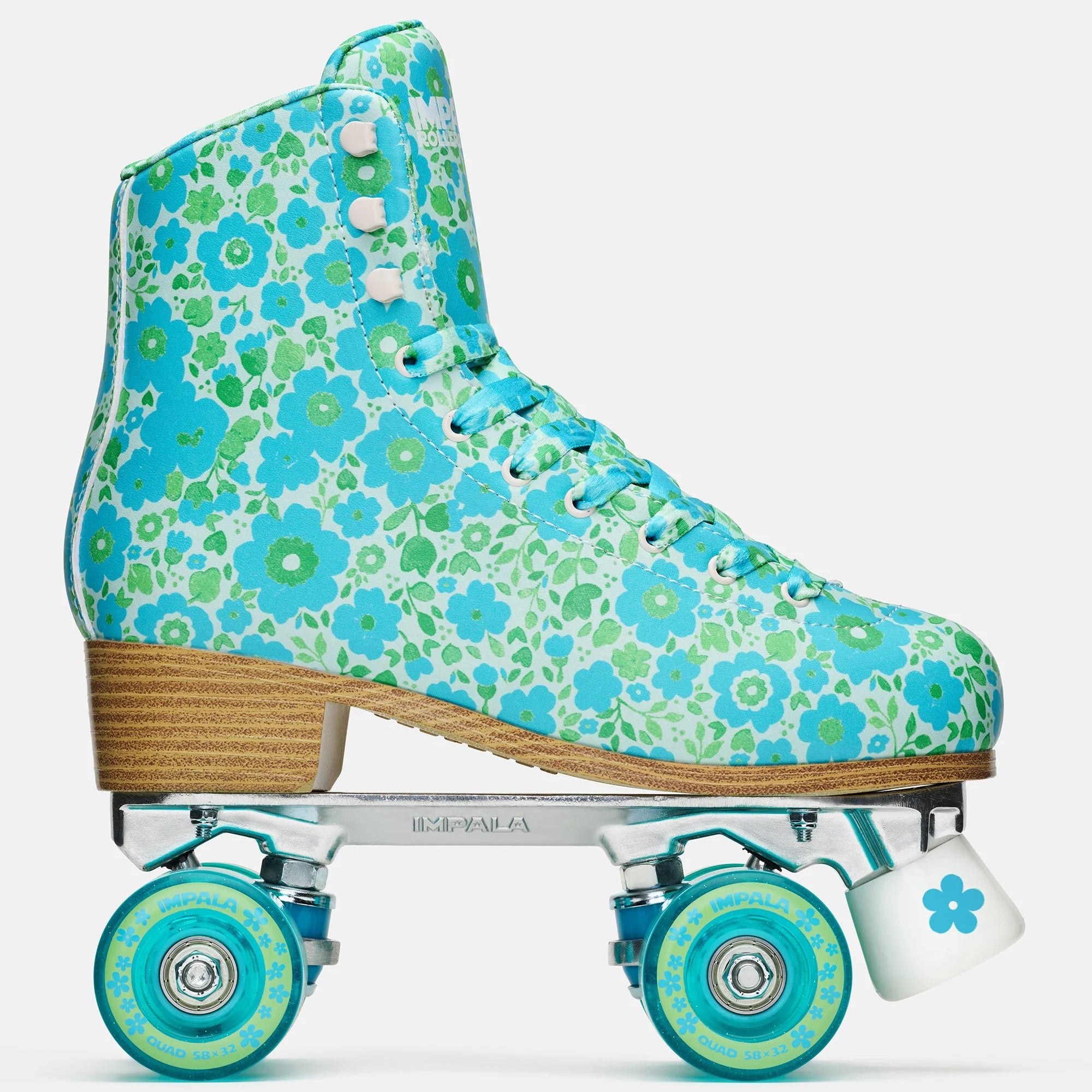 Teal floral high-top quad skates with lace-up front and turquoise wheels