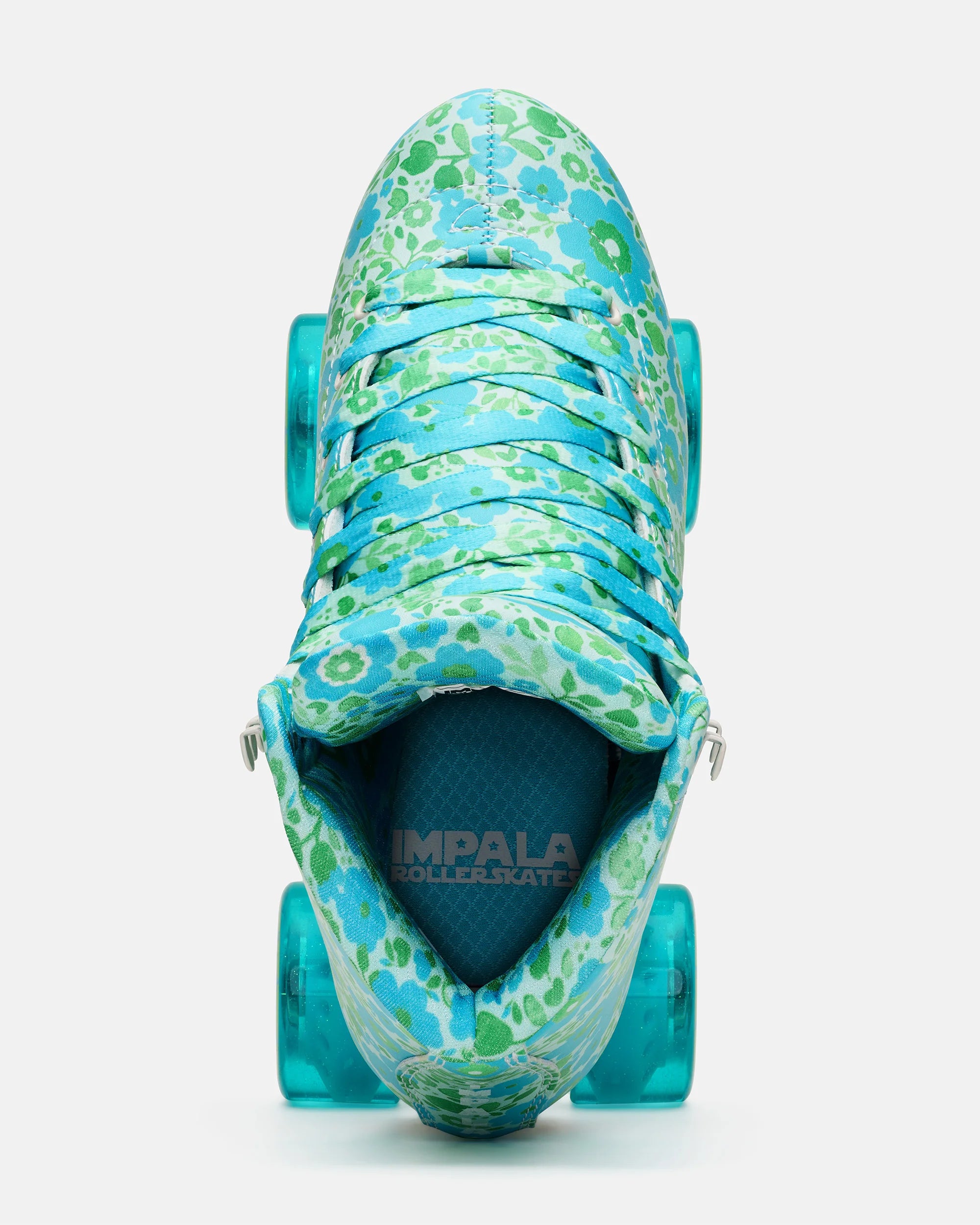 Teal floral quad skates with laced front, open interior, and turquoise wheels