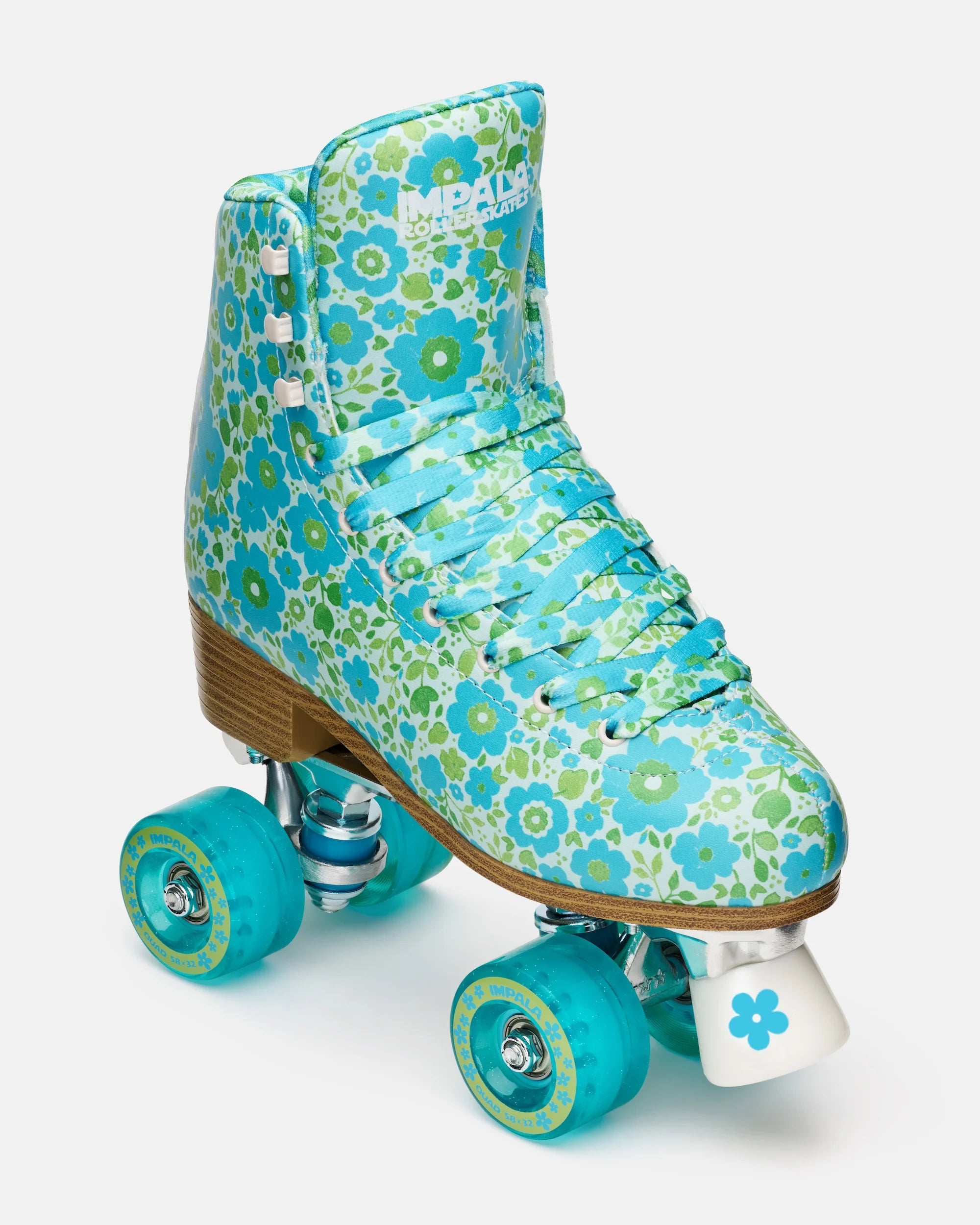 Teal floral high-top quad skates with teal wheels and light wood sole