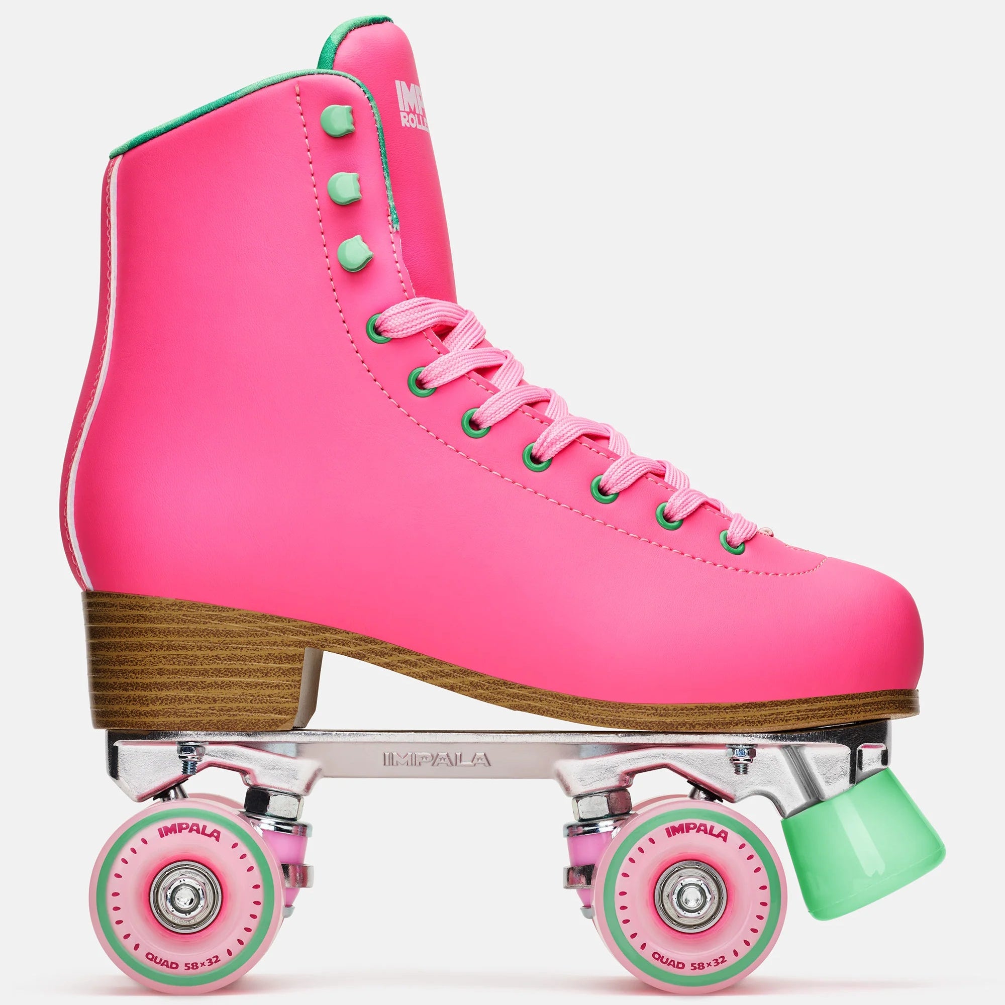 Pink high-top quad skates with green laces, wooden sole, mint wheels and hardware