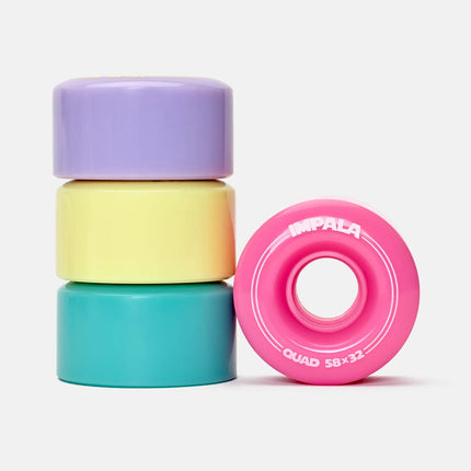 Pastel roller skate wheels set, four stacked; purple, yellow, teal, pink.