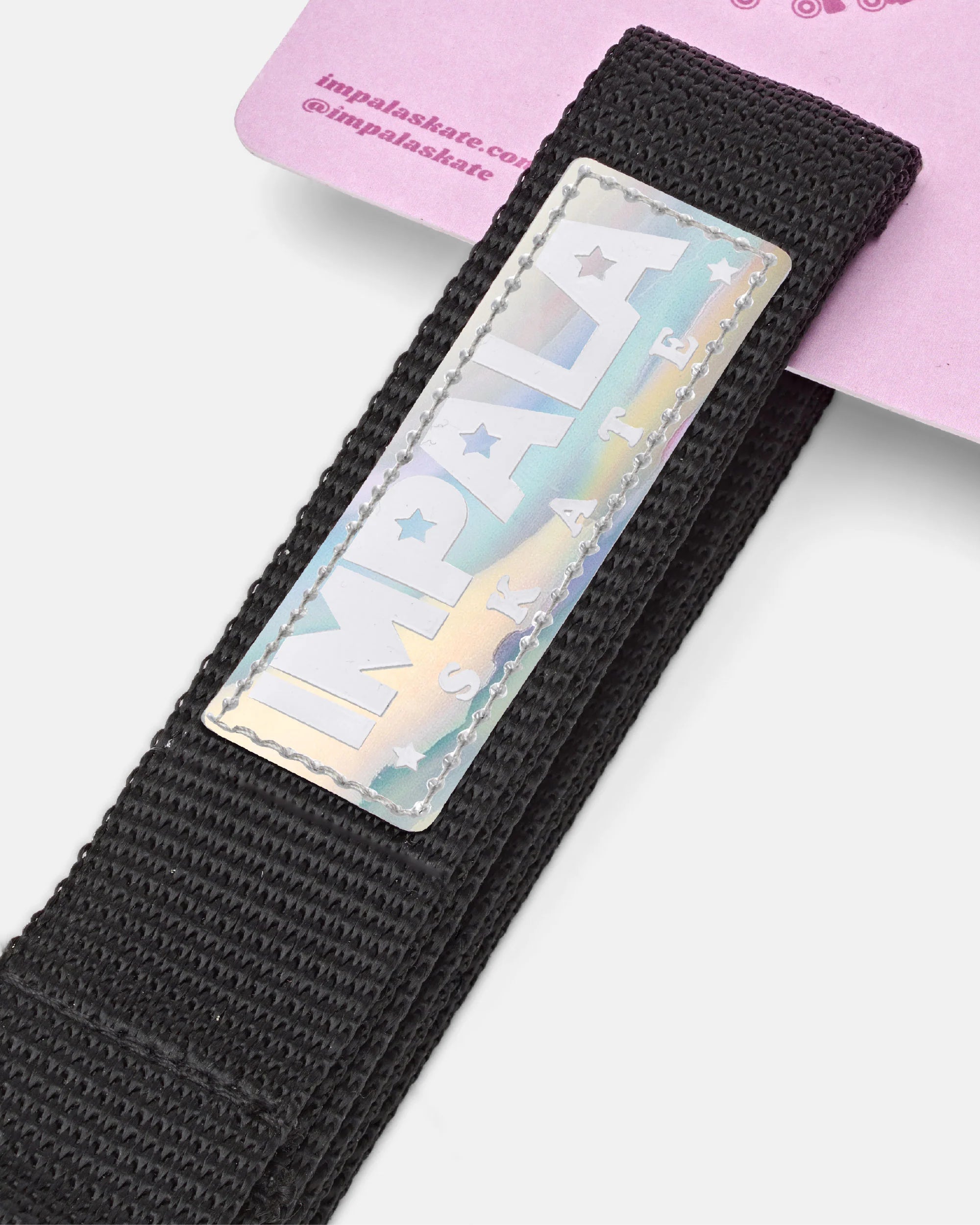 Black woven skate strap with printed rectangular Impala label