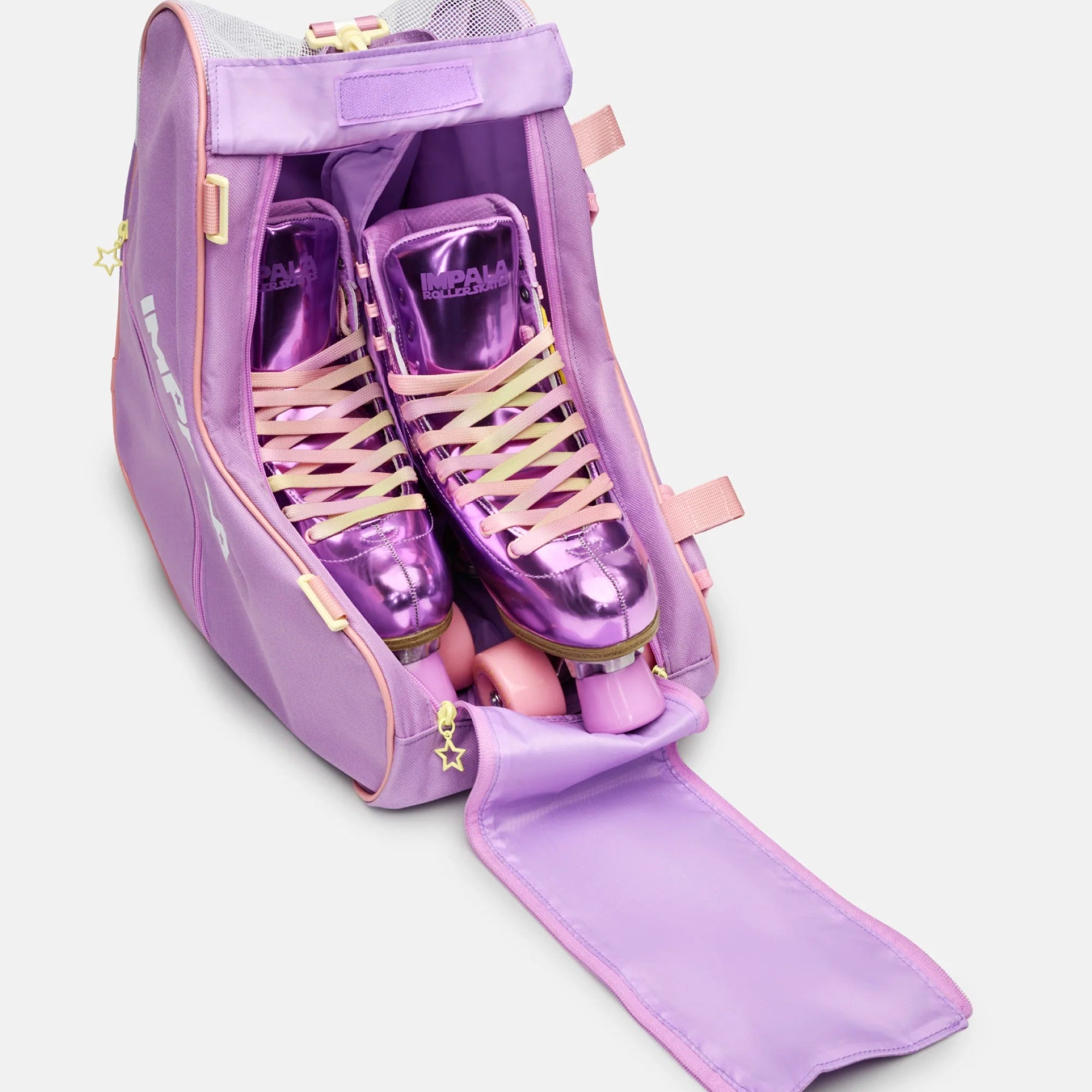Lavender heart-shaped skate bag open with purple roller skates in padded lining