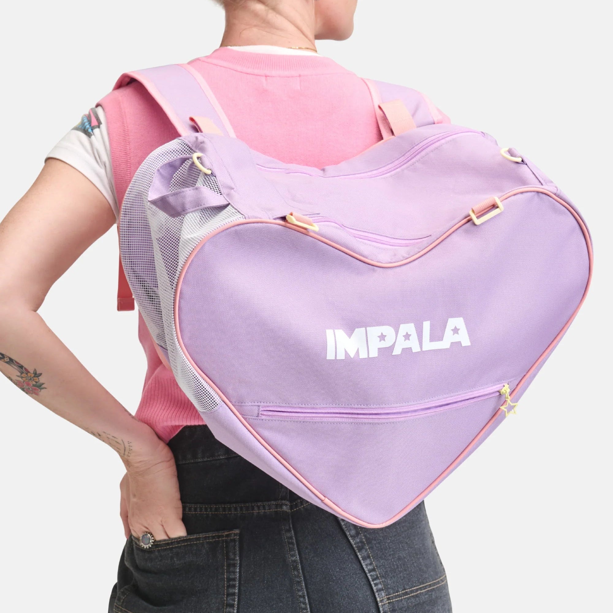 Lavender heart-shaped skate bag with IMPALA logo and adjustable straps