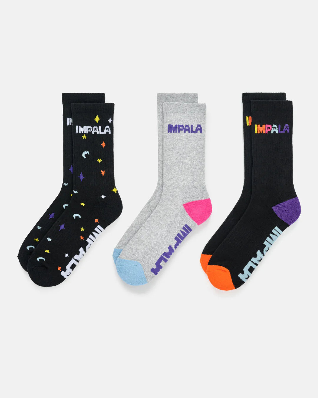 3-pack skate socks: black and light gray pairs with multicolor star and moon icons