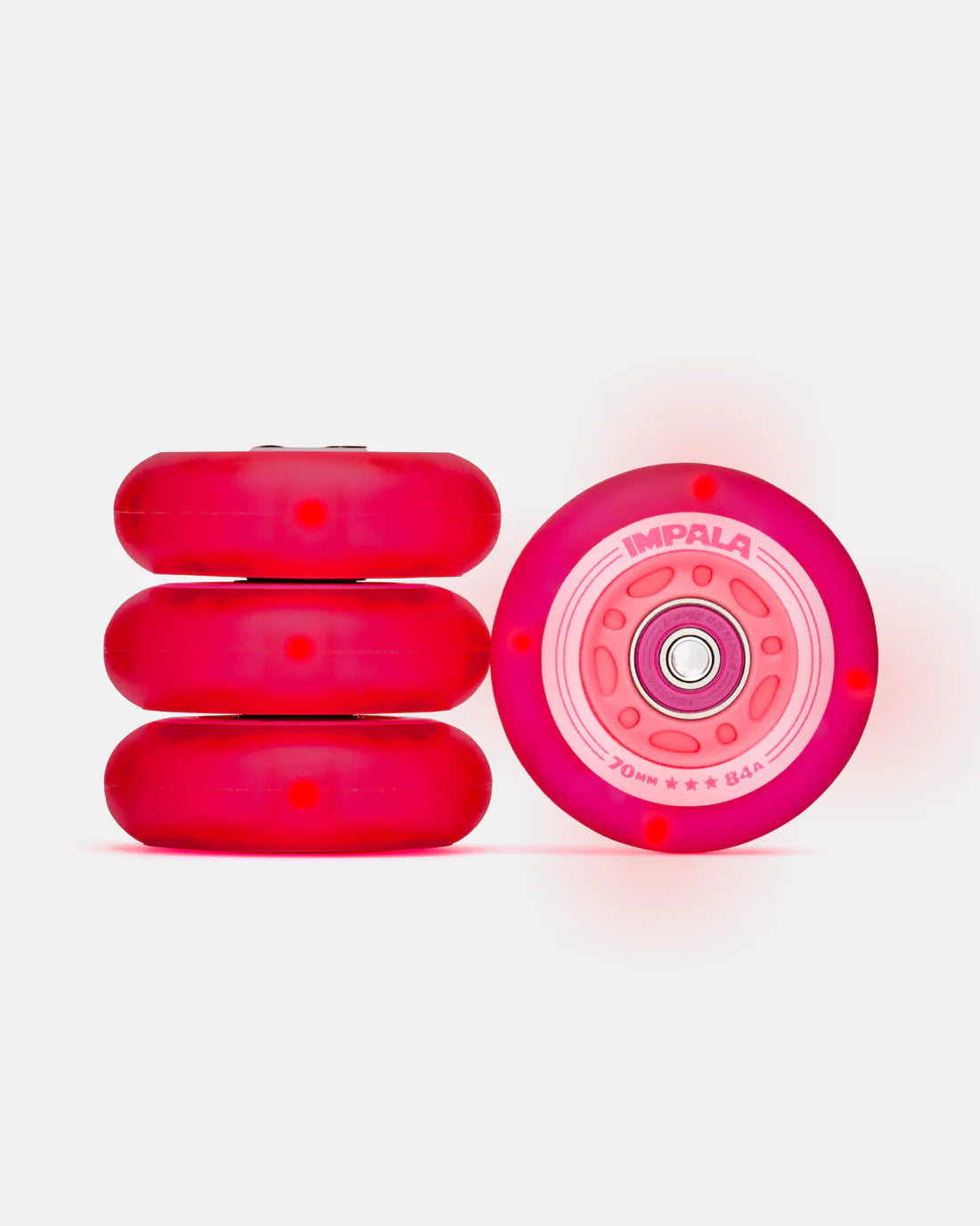 Red light-up inline wheels set with pink rim and starburst accents