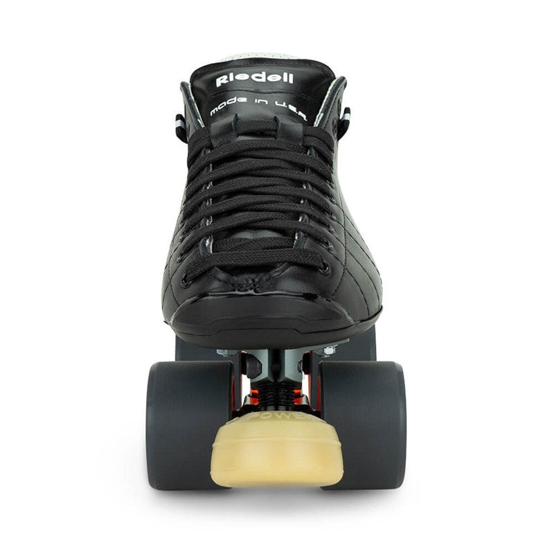 Front-facing black derby skate boot with orange wheels and yellow toe stop