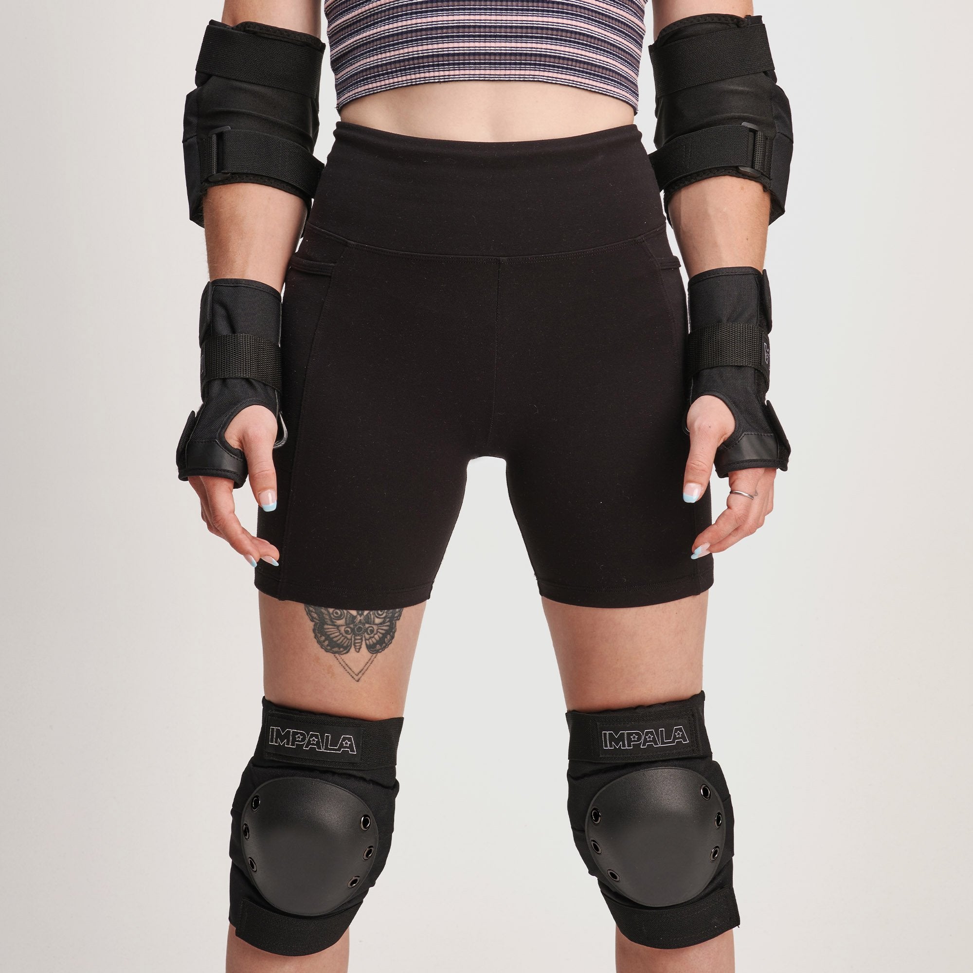 Black adult protective set with knee pads and hard shells on thighs