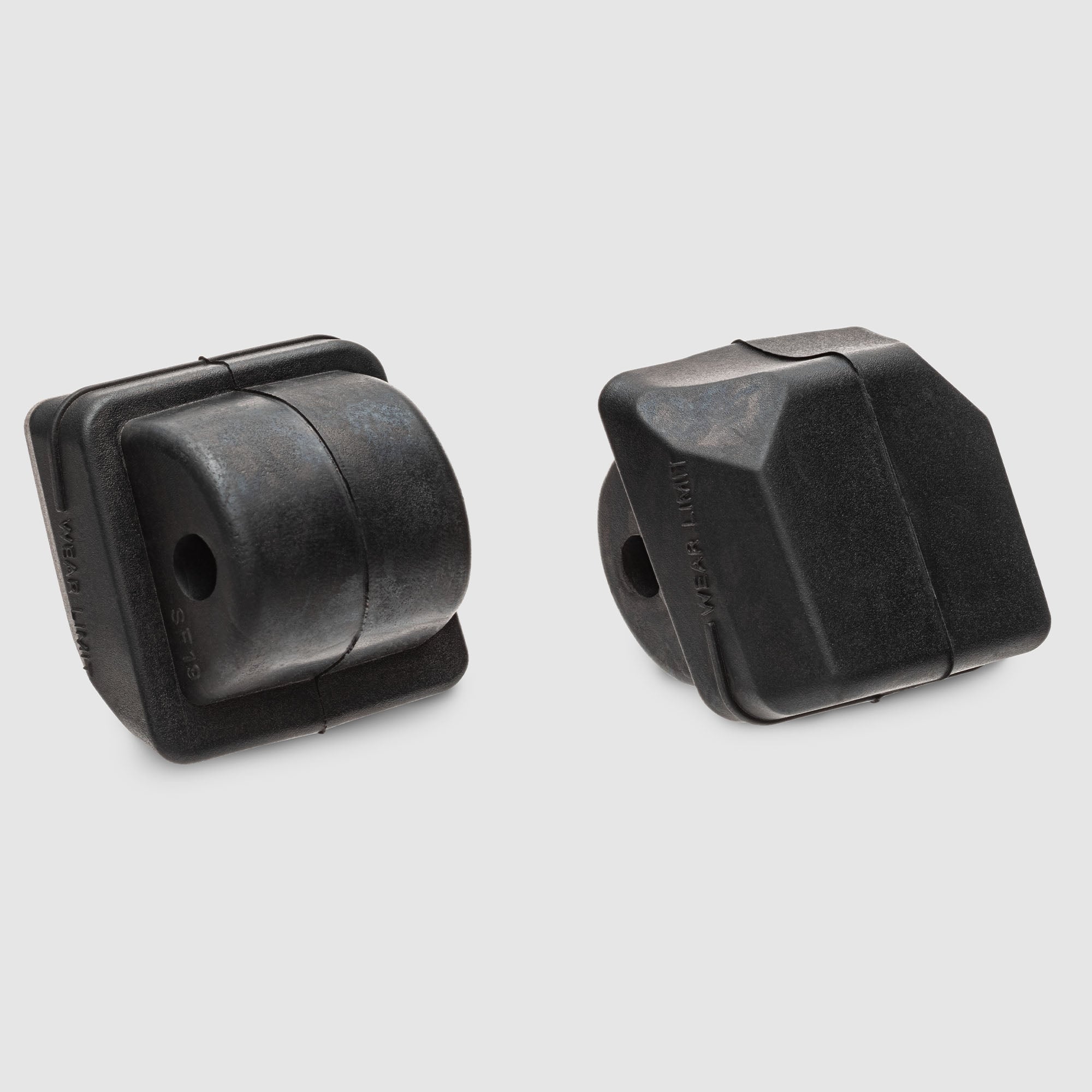 Pair of black inline skate brake pads, each with mounting hole