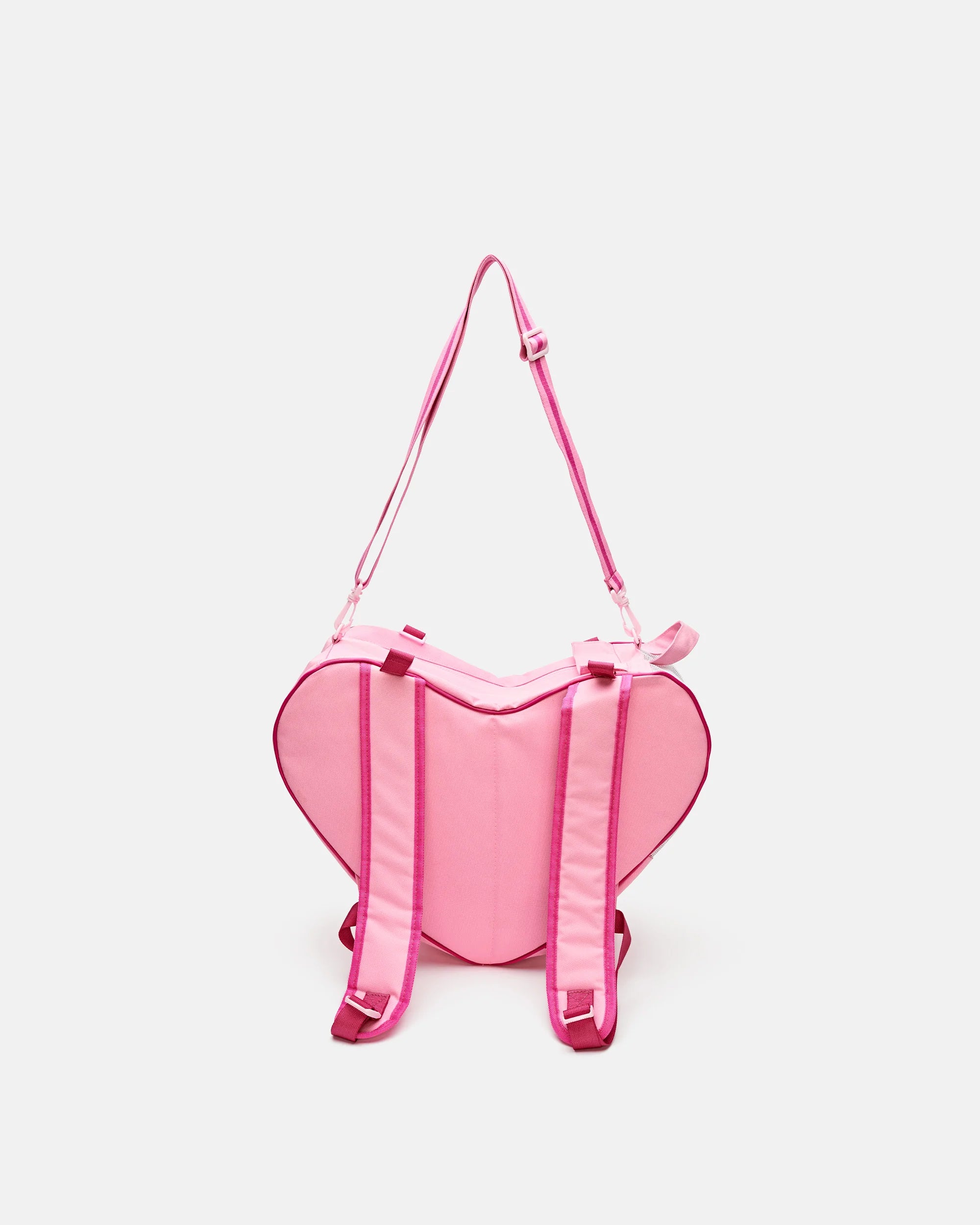 Pink heart-shaped skate bag with padded straps and top carry handle