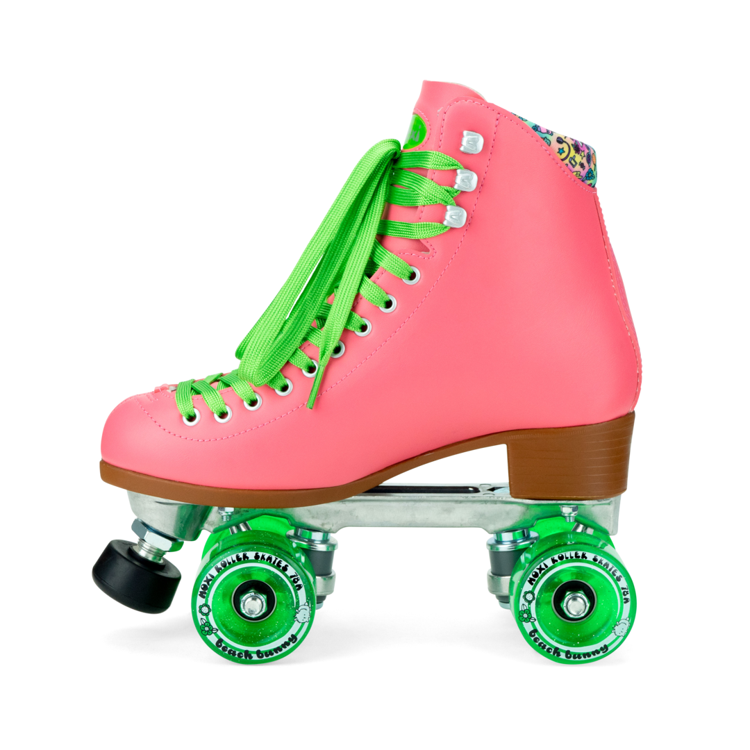 Pink high-top roller skates with green laces and green quad wheels, side view