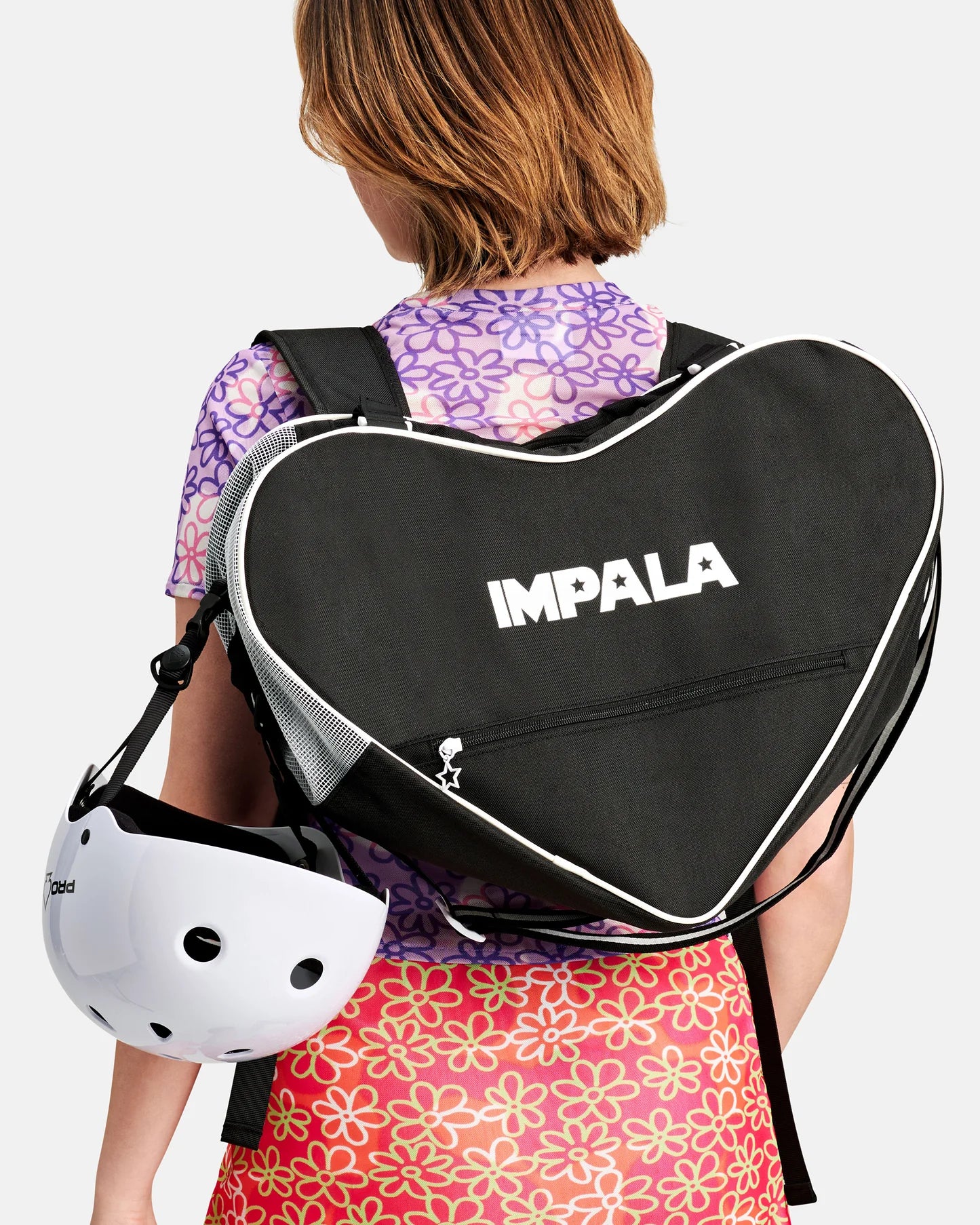 Black heart-shaped skate bag with IMPALA logo, zipper and white piping, carrying straps