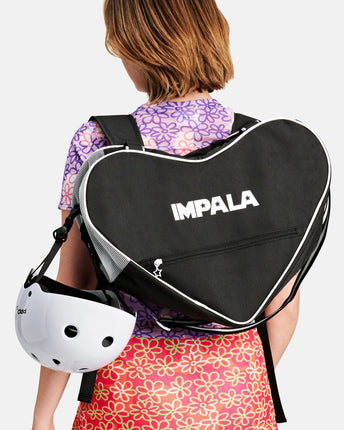 Black heart-shaped skate bag with IMPALA logo, zipper and white piping, carrying straps