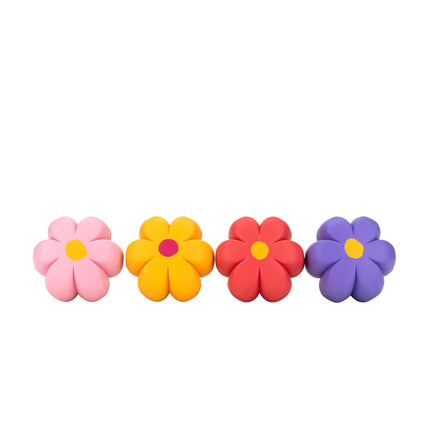 Flower-shaped brake petals in pink, yellow, red, and purple, four-pack.