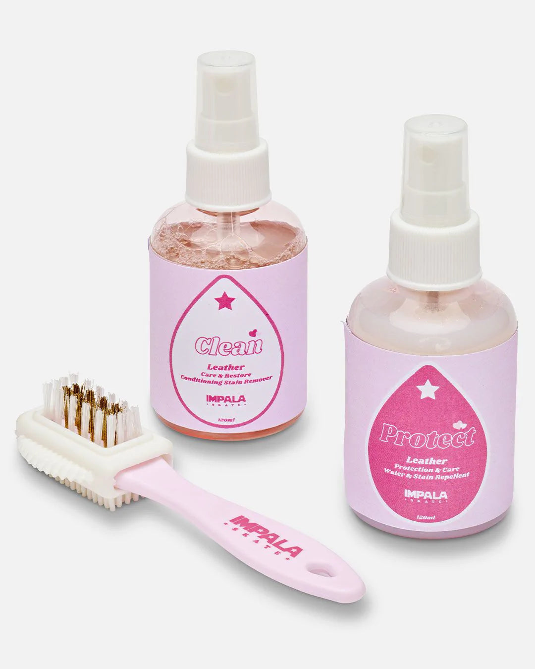 Impala suede care kit with leather cleaner, protectant bottles, and white brush