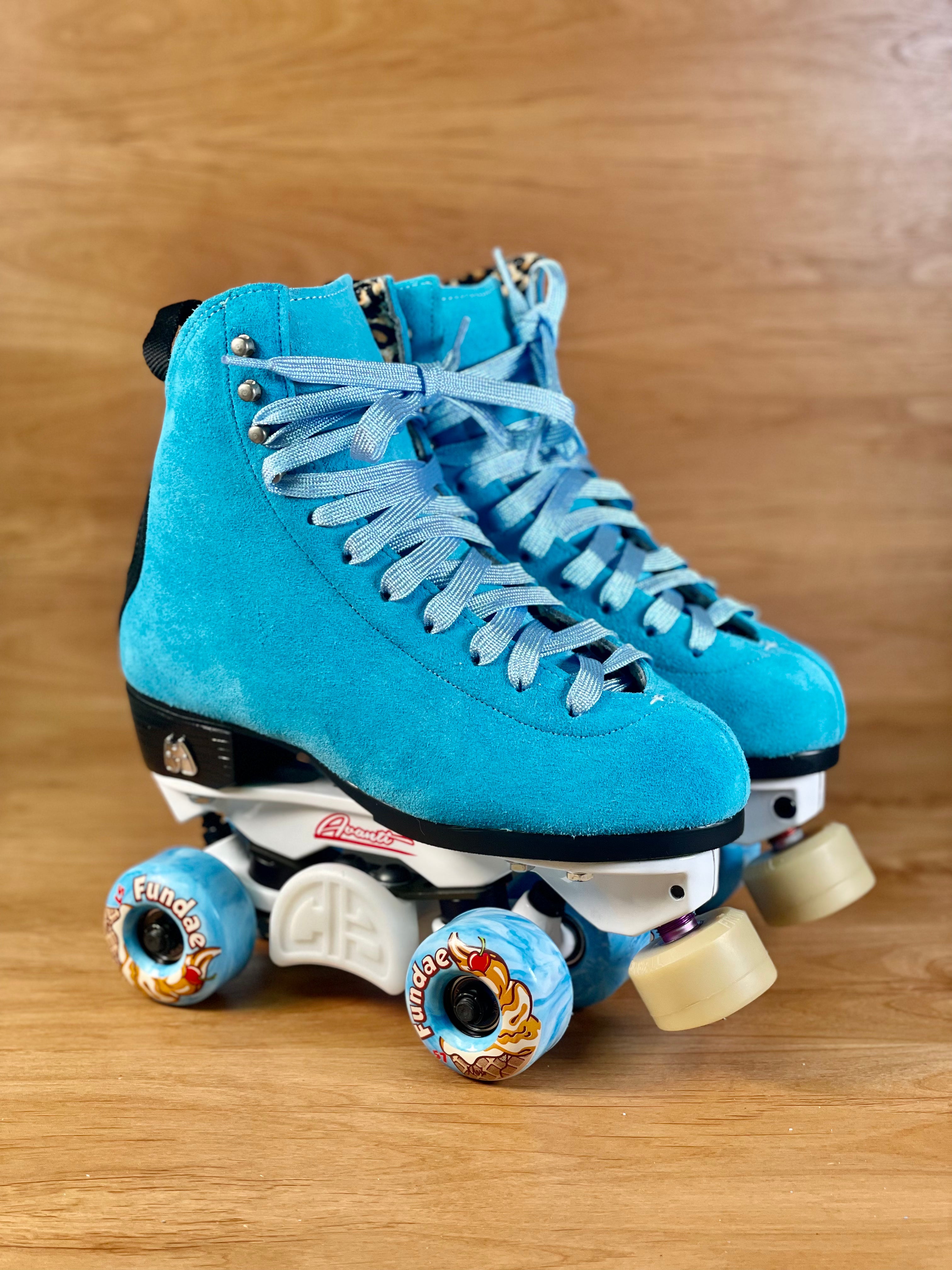 Blue suede high-top roller skates with light-blue laces and colorful wheel decals