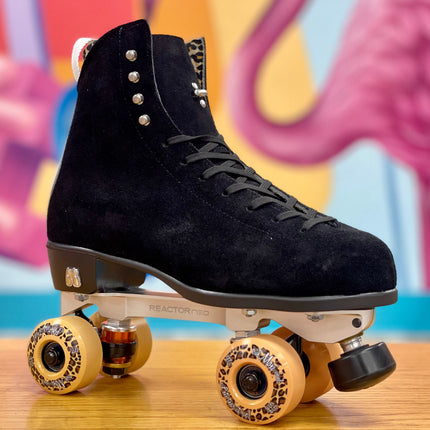 Black high-top suede skate boot on roller skates with yellow wheels